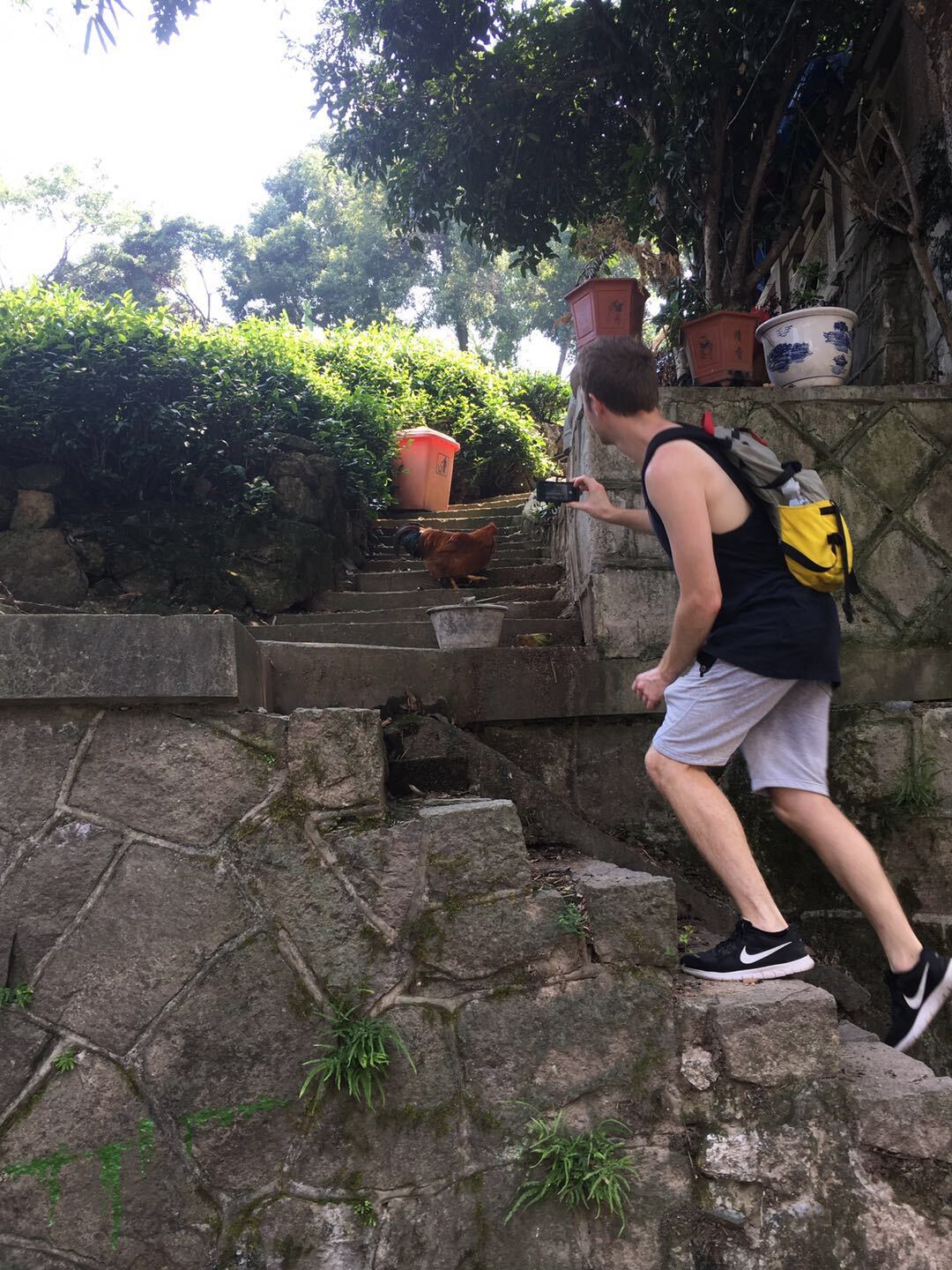 3 Me chasing a chicken through Longjing China