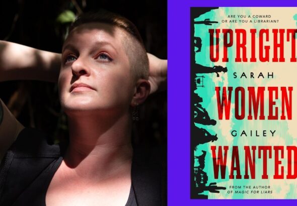 Sarah Gailey, a white person with auburn hair that is long on top and shaved on the sides, looking up with their hands behind their head. Dappled sun and shadow falls across their face, chest, and arms. Photo credit: ©Kate Dollarhyde 2023