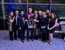 David Custer, center, at the 2026 National Academy of Television Arts & Sciences annual awards event with his Silver Circle induction plaque. Courtesy photo