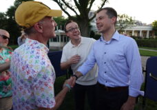 Pete Buttigieg, with husband Chasten behind him, greets guests at the 2024 White House Pride Picnic. Photo: Chris Azzopardi