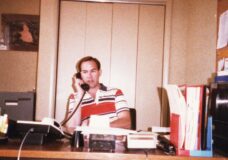 Terry Ryan at his desk at the HIV/ADS resource organization Wellness Networks in the 1980s. Courtesy photo