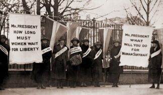 Crowd of women's suffrage supporters demonstrating with signs reading, "Wilson Against Women," in Chicago on October 20, 1916. Wilson withheld his support for women's suffrage until 1918. Photo: The Everett Collection via Canva Pro license