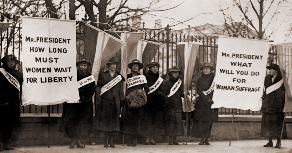 Crowd of women's suffrage supporters demonstrating with signs reading, "Wilson Against Women," in Chicago on October 20, 1916. Wilson withheld his support for women's suffrage until 1918. Photo: The Everett Collection via Canva Pro license