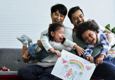 Male gay taking care adopted children who are happy diverse litt