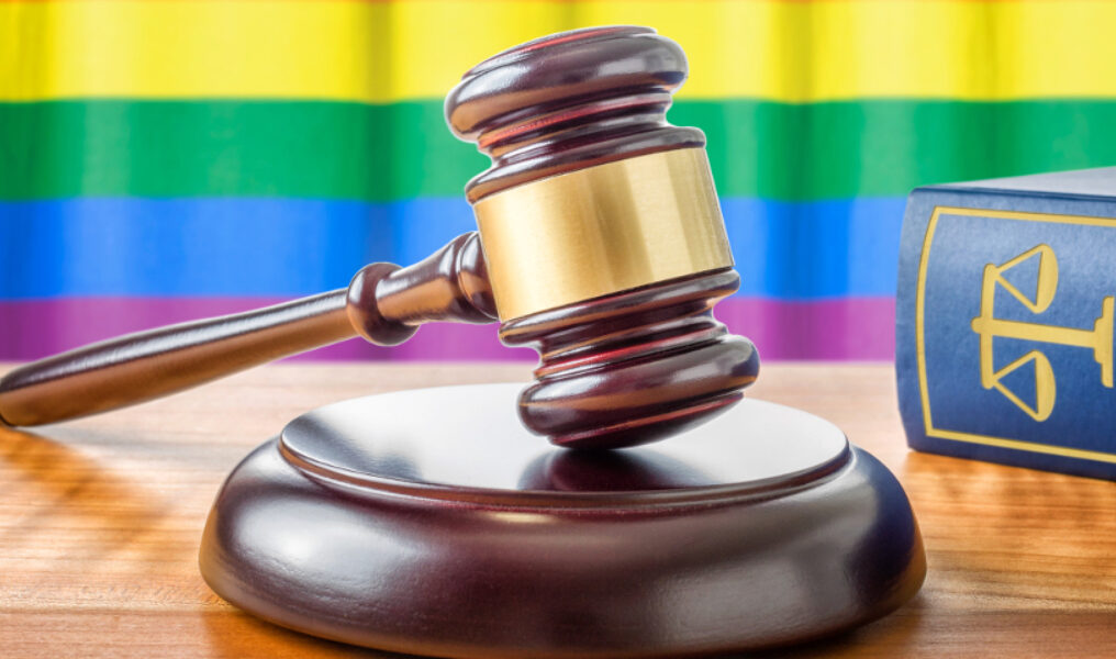 A gavel and a law book - Rainbow flag