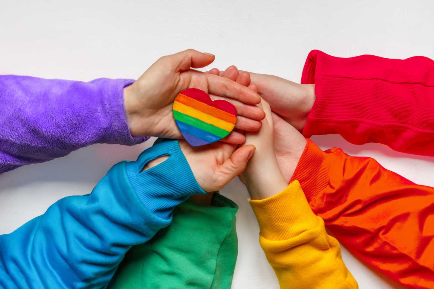 LGBT people hands in clothes the colors of the rainbow flag LGBT