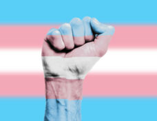 Transgender flag painted on a clenched fist. Strength, Power, Protest concept