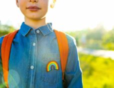 Girl In Denim T-shirt With Rainbow Symbol Wear Backpack In Summer Park Outdoor