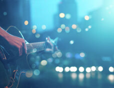 Guitarist on stage for background, soft and blur concept