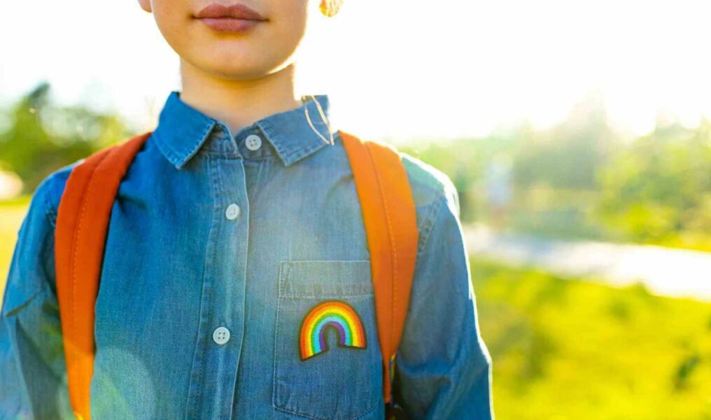 Girl In Denim T-shirt With Rainbow Symbol Wear Backpack In Summer Park Outdoor