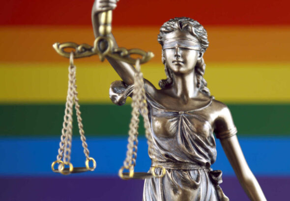 Symbol of law and justice with Rainbow Flag. Close up.