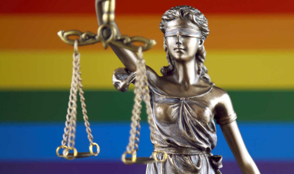 Symbol of law and justice with Rainbow Flag. Close up.