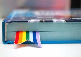 bigstock-Book-With-A-Bookmark-Of-Rainbo-311949847-scaled