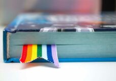 bigstock-Book-With-A-Bookmark-Of-Rainbo-311949847-scaled