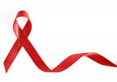AIDS_awareness_red_ribbon_insert_by_Bigstock