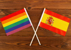 Rainbow Flag Lgbt And Flag Of Spain On Brown Wood Planks Backgro