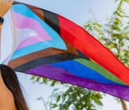 Progress Pride Flag (new Design Of Rainbow Flag) Waving In The Air With Blue Sky, Celebration Of Gay