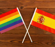 Rainbow Flag Lgbt And Flag Of Spain On Brown Wood Planks Backgro