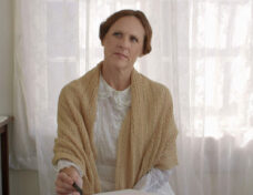 Emily-Molly-Shannon-thinking-at-her-desk-WILD-NIGHTS-WITH-EMILY-Courtesy-of-Greenwich-Entertainment