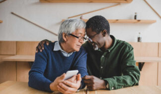 Senior couple sitting indoors