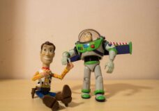AVOLA, ITALY - Mar 21, 2021: Woody and Buzz Lightyear toys holding their hands-070711530