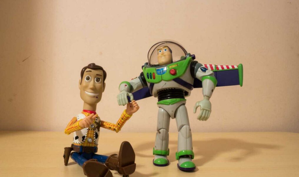 AVOLA, ITALY - Mar 21, 2021: Woody and Buzz Lightyear toys holding their hands-070711530
